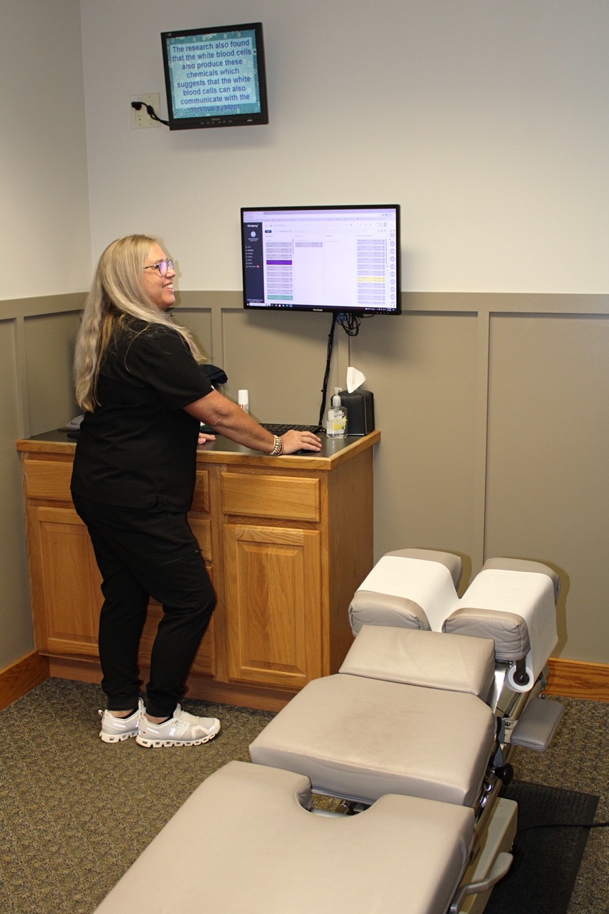 Tina, our chiropractic assistant, in our adjustment room.